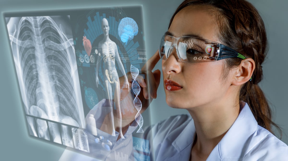 medical professional looking at body scan though vr glasses.